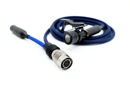Close-up of Bolero talkback adapter showing the locking Hirose-style connector end of a blue cable, with a clip-on lavalier microphone in the background